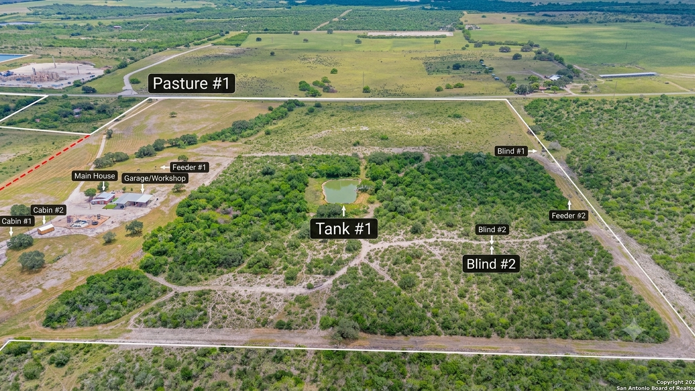 Aerial view of 2 Hearts Infinity Ranch showing pastures, blinds, feeders, tank, cabin, and main house